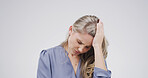 Studio, stress and woman with headache, pain and overwhelmed with workload, thinking and frustrated. White background, anxiety and person with migraine, contemplating and publicist with burnout