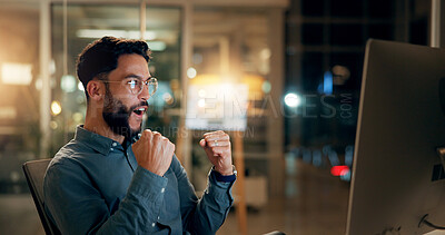 Buy stock photo Excited, businessman and night with fist pump on computer for winning, investment or promotion at office. Happy, man or employee working late with smile on pc for good news, celebration or bonus