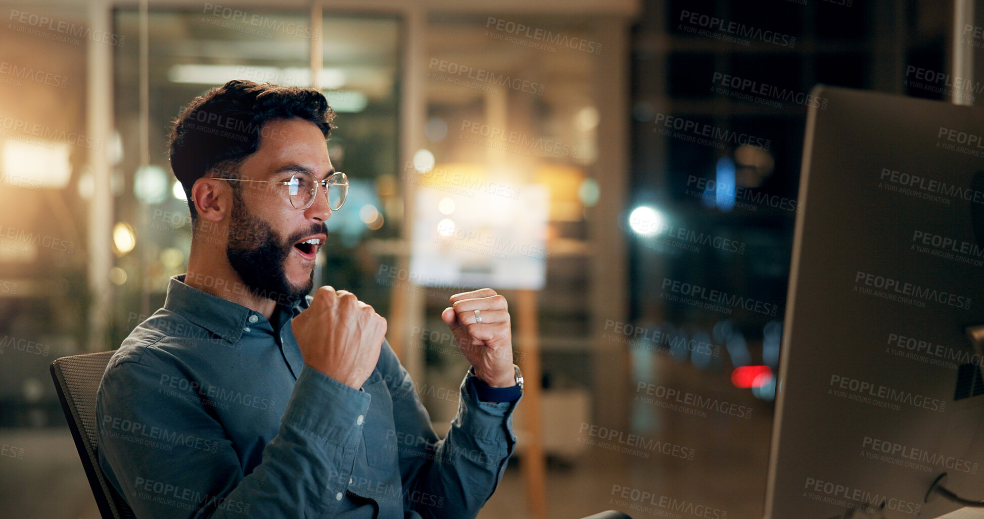 Buy stock photo Excited, businessman and night with fist pump on computer for winning, investment or promotion at office. Happy, man or employee working late with smile on pc for good news, celebration or bonus