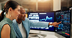 Computer screen, investment and pointing with business women in office together for stock market trading. Conversation, data or info with trader people in workplace for portfolio management at night
