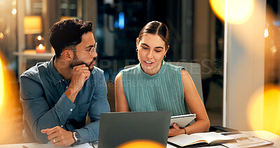 Buy stock photo Man, woman and meeting with laptop at night for planning, story feedback and project deadline. People, explain and brainstorming with team, research and article schedule for  publication for overtime