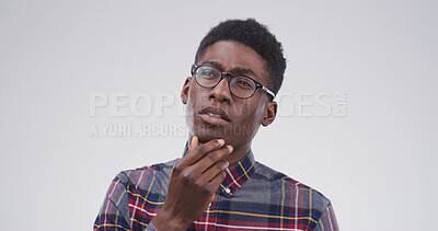 Buy stock photo Black man, thinking and student in studio with mock up space, confused or doubt on white background. African person, nerd and perspective for education, solution and choice for university scholarship