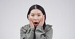 Portrait, woman and shocked reaction in studio for scary gossip, bad news and fake rumor. Female person, space and mind blowing for horror story, danger risk and secret revelation on white background