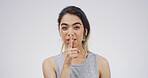 Portrait, student and woman with secret, privacy or gesture for mystery, studio or confidential info. White background, shush and person with sign for silence, pupil or finger for shut up or reaction