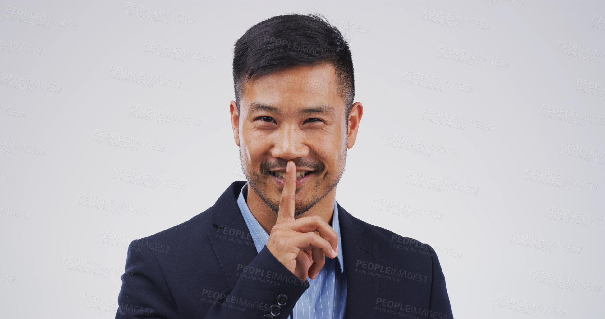Buy stock photo Businessman, portrait and finger with hush, studio and silence for mystery announcement. Model, gossip and secret with corporate rumor, whisper and gesture for news and privacy on white background