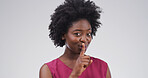 Black woman, portrait and finger with rumor, studio and silence for mystery announcement. Model, gossip and secret with hush, whisper and gesture for news, opinion and privacy on white background