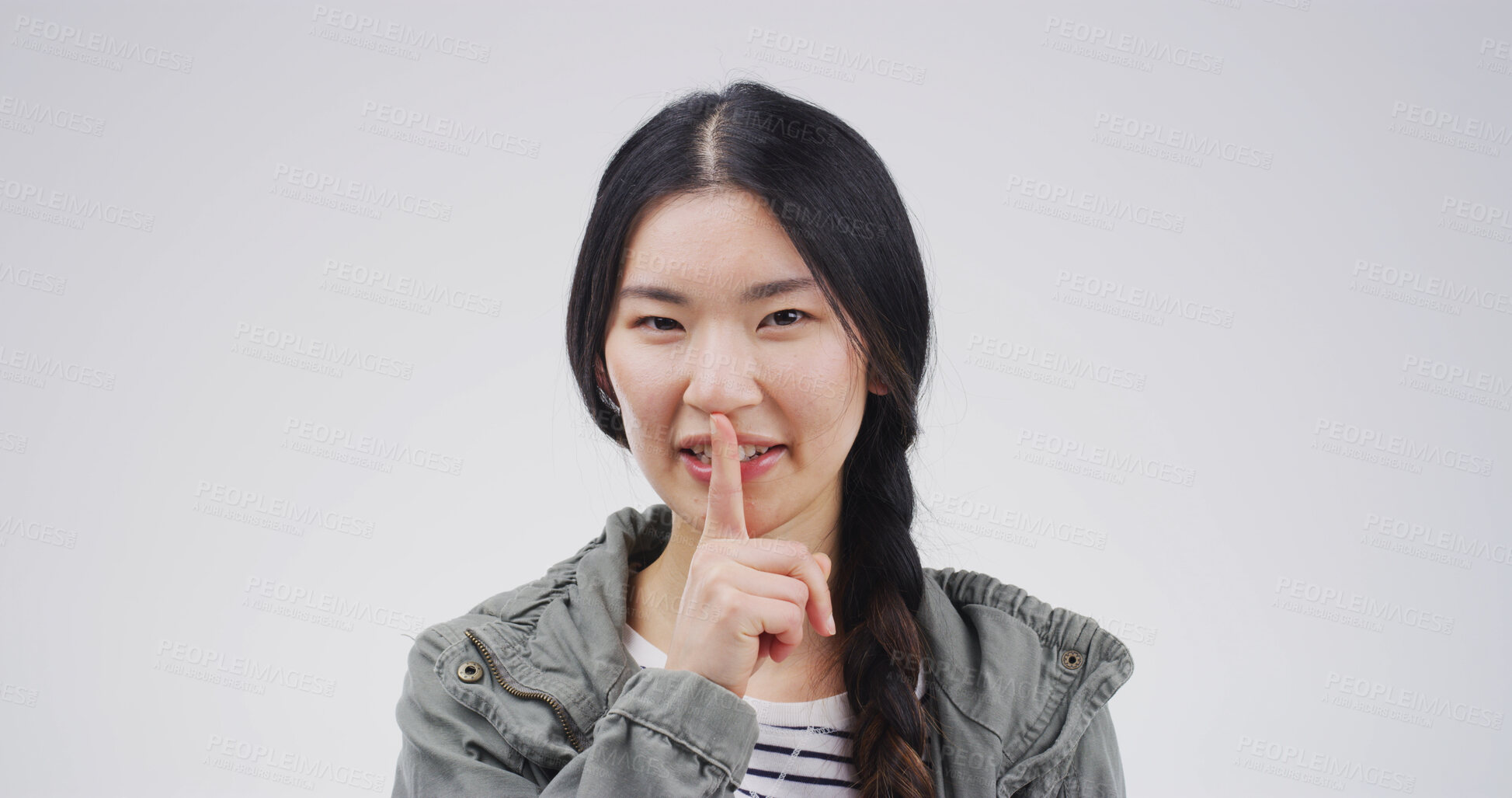 Buy stock photo Happy, portrait and woman in studio with secret, gossip or confidential hand gesture for privacy. Quiet, smile and Asian person with finger on lips for silence or noise control by white background.