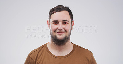 Buy stock photo Portrait, creative and happy with man in studio for fashion, casual clothes and designer. Smile, male person and thrifting style with t shirt, minimalistic outfit and good mood on white background
