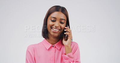 Buy stock photo Studio, woman and talking to contact, phone call and communication with tech, network or discussion. White background, Indian person and chat with mobile, listen and happy for conversation and gossip