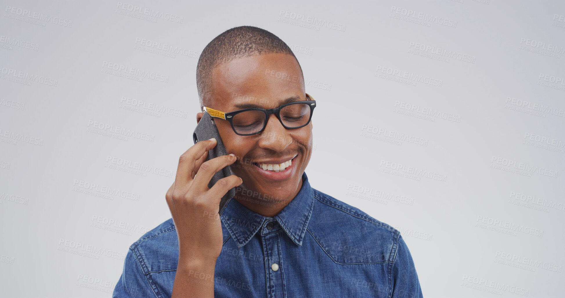 Buy stock photo Happy, black man and talking with phone call in studio for campaign feedback, good news or chat. Creative, mockup space or person speaking to contact for networking or negotiation on white background