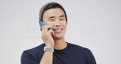 Buy stock photo Asian man, happy and phone call in studio for communication, contact or chat on white background. Smile, male person with mobile conversation or networking for connection, space or technology