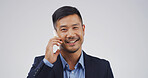 Businessman, phone call and happy in studio for talk, mock up space and portrait on white background. Asian person, lawyer and attorney with legal consultation, advice and smartphone in Indonesia