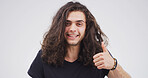 Thumbs up, happy and portrait of man in studio for agreement, feedback or vote for creative career. Smile, good news and male copywriter with approval hand gesture for publishing by white background.