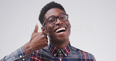 Buy stock photo Glasses, portrait or black man with thumbs up in studio for frame choice, vision approval or happy. Mockup, smile and person with like emoji for eye care or prescription feedback on white background