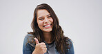 Portrait, smile and woman with thumbs up in studio for success, support or agreement. Happy, model and like hand gesture with emoji for feedback, excellence and review on white background space