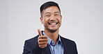 Happy businessman, portrait or thumbs up in studio for good job or OK on a white background. Face, man or model with smile, like emoji or yes sign for welll done, thank you or success on mockup space