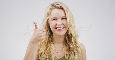 Buy stock photo Girl, thumbs up and portrait with agreement in studio, support or motivation with success. Thank you, feedback or vote with hand gesture, review and space with approval isolated on white background
