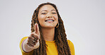 Black woman, braces and thumbs up in studio for approval feedback and emoji on white background. Female person, dental health and icon for affirmation, promotion and portrait for review or great news