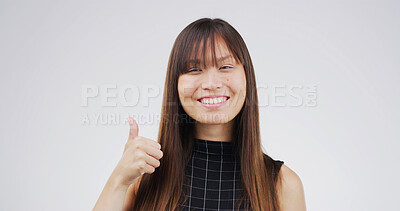Buy stock photo Thumbs up, excited and portrait of businesswoman in studio for agreement, feedback or vote for investment. Smile, good news and Asian financial manager with approval hand gesture by white background.