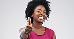 Black woman, thumbs up and portrait with agreement in studio, support or motivation with success. Thanks, feedback or vote with hand gesture, review and space with approval on white background