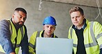 Man, laptop and team at construction site with meeting, review and planning for renovation project. Lead engineer, checklist and staff for architecture, computer and feedback for property development