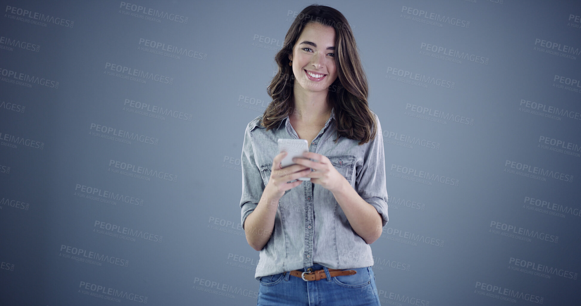 Buy stock photo Intern, phone and smile with portrait of woman in studio for social media, branding and communication. Learning opportunity, campaign research and online launch with person on dark background space