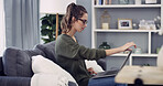 Woman, freelancer and home with laptop for journalism, research or copywriting on sofa. Female person, journalist or copywriter with computer for remote work, online article or story blog in house