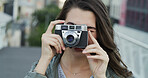 Capture, camera and woman with photography in city for travel memories, vacation tour and scenery. Tourist, global trip and person with pictures for urban sightseeing, weekend journey and adventure
