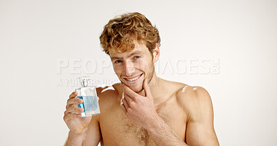 Buy stock photo Portrait, confident and man with cologne, studio or self care with product for fresh scent or spray. White background, pride and person with cosmetics for fragrance, smell and grooming with perfume