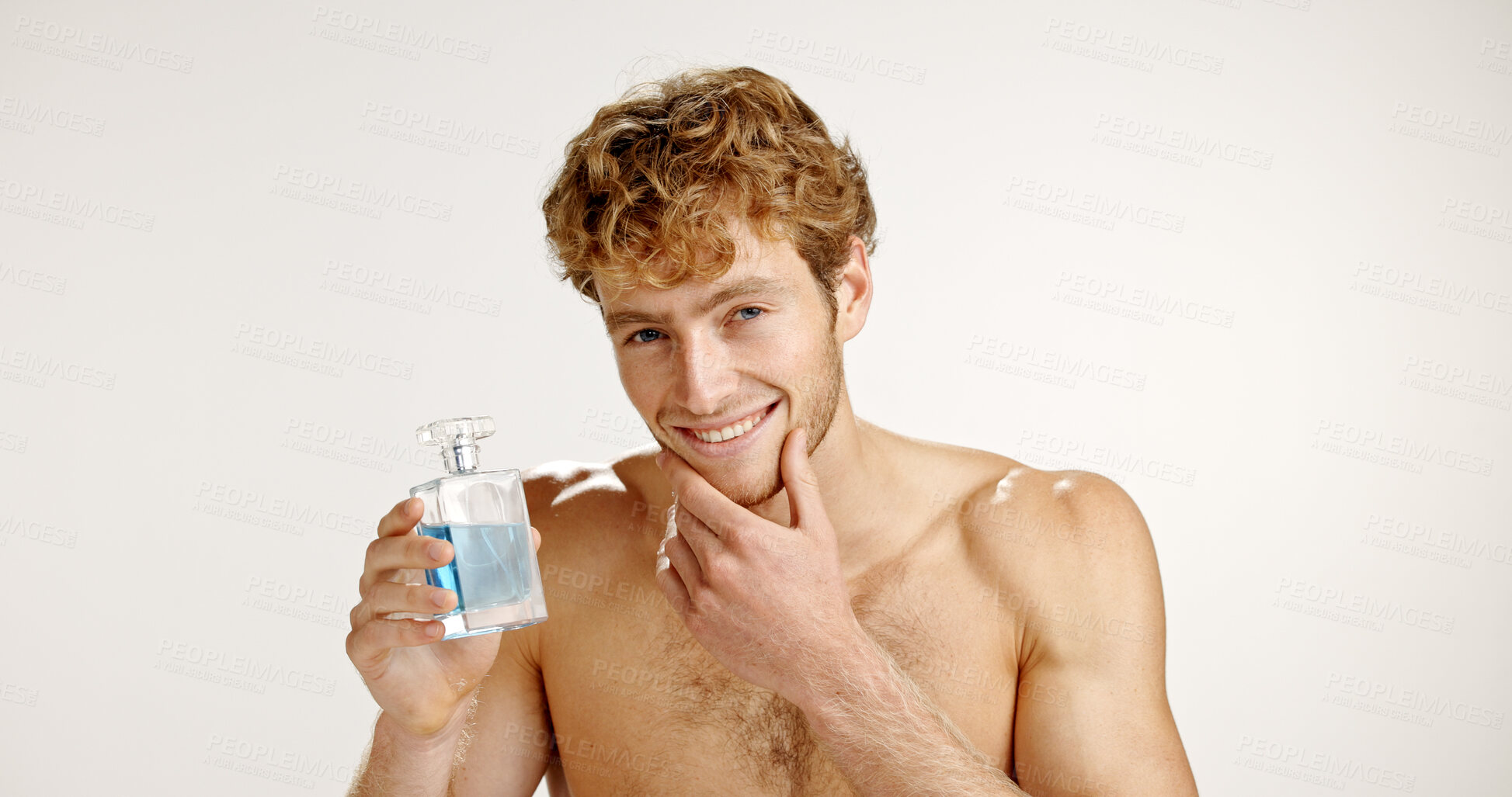 Buy stock photo Portrait, confident and man with cologne, studio or self care with product for fresh scent or spray. White background, pride and person with cosmetics for fragrance, smell and grooming with perfume