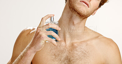 Buy stock photo Fragrance, spray neck and man with cologne for grooming or hygiene on white studio background. Perfume, fresh scent and model with luxury cosmetics product for beauty, self care and odor control