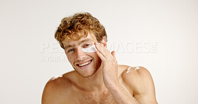 Buy stock photo Skincare, eye patches and portrait of man in studio with natural, wellness or health routine. Happy, collagen masks and male person with cosmetic products for dermatology by white background space