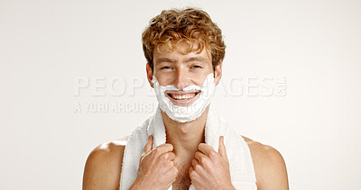 Buy stock photo Portrait, shaving cream and man in studio, smile and grooming on white background. Face, happy person and model with towel, beard care and wellness with hair removal, beauty and facial product