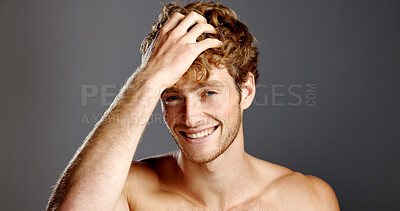 Buy stock photo Portrait, happy man and hair care in studio for beauty, grooming and texture on gray background. Face, hairstyle and male person at salon for scalp treatment, barber or growth cosmetics for aesthetic