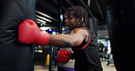Boxer, man and workout with punching bag in gym for fight training, combat sports and technique. Athlete, fitness and black person with boxing at health club for conditioning and endurance exercise