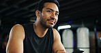 Thinking, athlete and man in gym, routine or plan for exercise, bodybuilding or decision for health. Fitness center, bodybuilder and person with equipment for workout, wellness and contemplating
