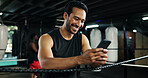 Fitness, happy man and phone in boxing ring for contact, training meme or latest sports news on break. Boxer, rest and mobile at gym for social media, status update and funny post on exercise forum