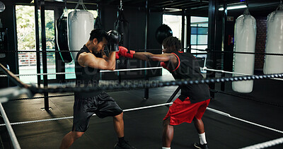 Buy stock photo Gym, self defense and training with people in boxing ring for sports, fitness or sparring. Boxer, challenge and fight with men punching in combat for competition, exercise or performance as athlete