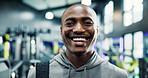 Happy, confident and portrait of black man in gym for workout, fitness or exercise for wellness. Smile, health and face of African male athlete from Nigeria with pride for training in sports center.