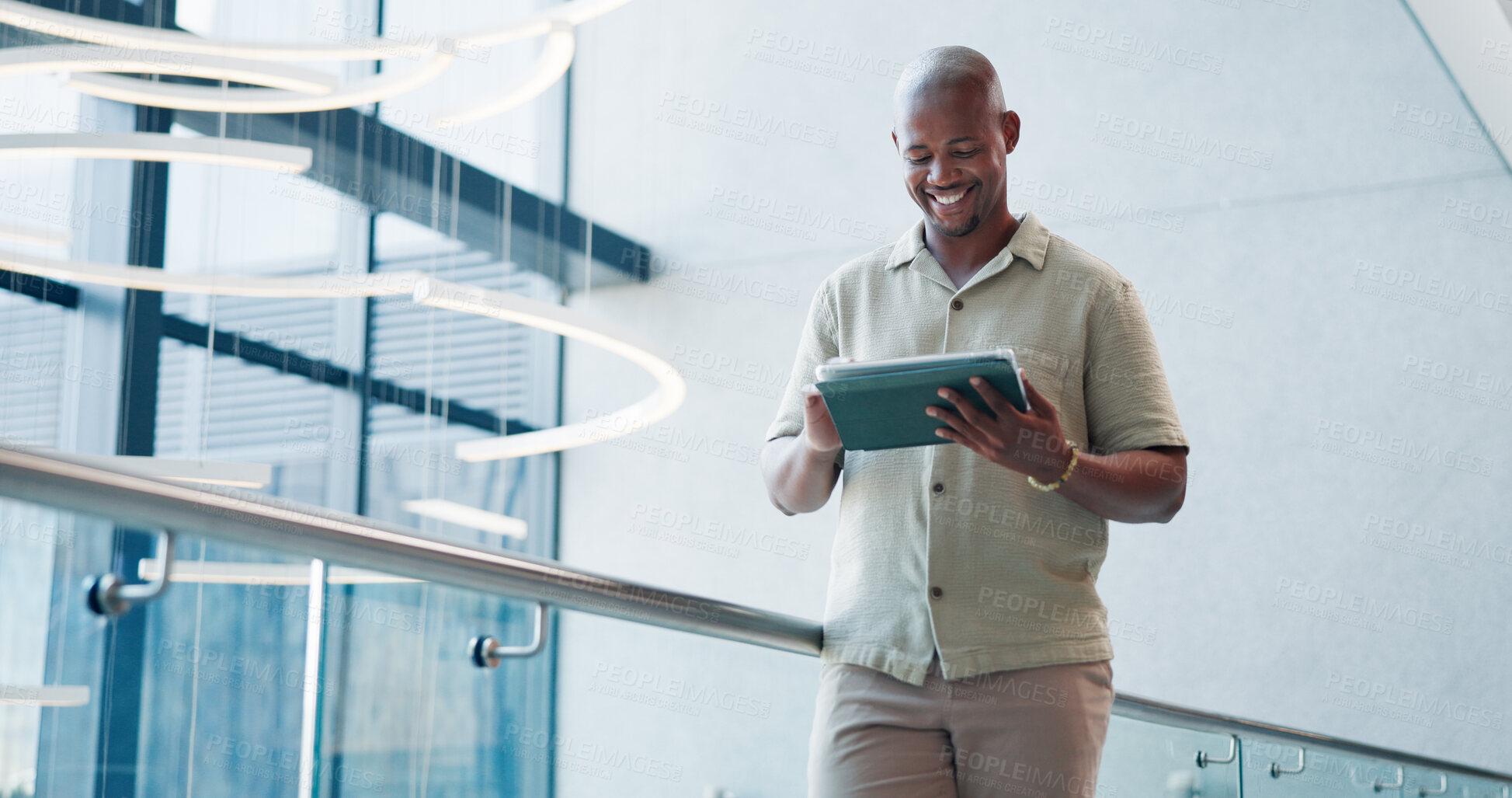 Buy stock photo Business, smile and black man in office, tablet and funny meme with creative project. African person, employee and consultant in workplace, tech and digital app with email for feedback and chatting