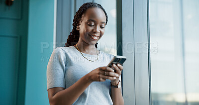 Buy stock photo Business, window and black woman in office, smartphone and message to contact, texting or typing. African person, view or employee in workplace, mobile user or cellphone with social media or chatting