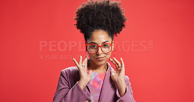 Buy stock photo Portrait, African woman and fashion in studio with earrings, glasses and trendy clothes. Proud, female person and positive attitude with jewellery, stylish outfit and accessories on red background