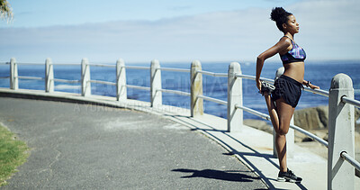 Buy stock photo Black woman, exercise and stretching legs at beach promenade, ready or thinking for fitness. African runner, girl and reflection with profile for workout, training or ocean with warm up in Nigeria