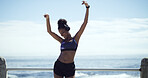Athlete, headphones or happy woman at beach with dance for running, workout or outdoor training. Freedom, sports and runner with music to listen to audio with fitness exercise, song and sky space