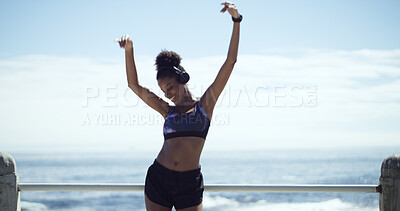 Buy stock photo Athlete, headphones or happy woman at beach with dance for running, workout or outdoor training. Freedom, sports and runner with music to listen to audio with fitness exercise, song and sky space
