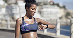Fitness, check smart watch and woman outdoor for heart rate, training progress or results. Wristwatch, exercise and happy African person in city for health stats, timer and info for cardio wellness