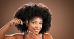 Skincare, happy and woman with jade roller in studio for lymphatic drainage, radiance or routine. Mockup, mature black person and cosmetics tool for anti aging and beauty portrait on brown background