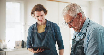 Buy stock photo Mature man, chef or cooking with tablet in kitchen for culinary skill or hospitality in home. Male people, mentor and helping assistant with technology for meal prep, house recipe or food cuisine