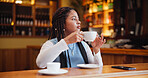 Woman, thinking or drinking with coffee in cafe for morning beverage, vision or break. Female person, freelancer or contemplating with warm cup or mug in restaurant for caffeine, tea or hospitality