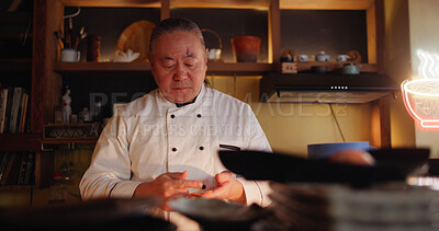 Buy stock photo Cooking, restaurant and sushi with Asian chef in kitchen for culinary service or hospitality. Food, recipe and salmon with mature man preparing traditional cuisine or delicacy as small business owner